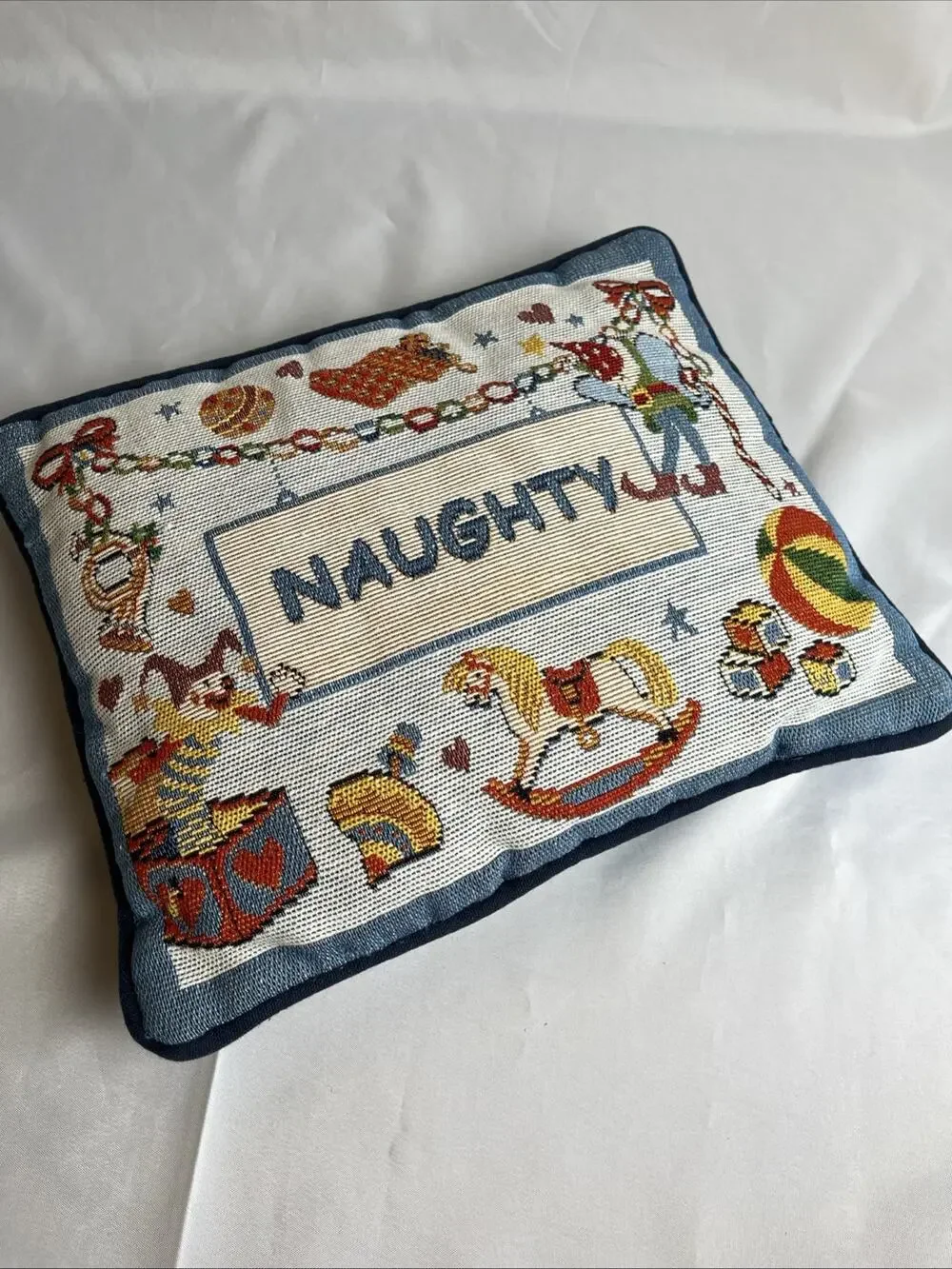 Tapestry Throw Pillow “Naughty” Christmas Decor Regtangular 12”x10”, Toy Motif